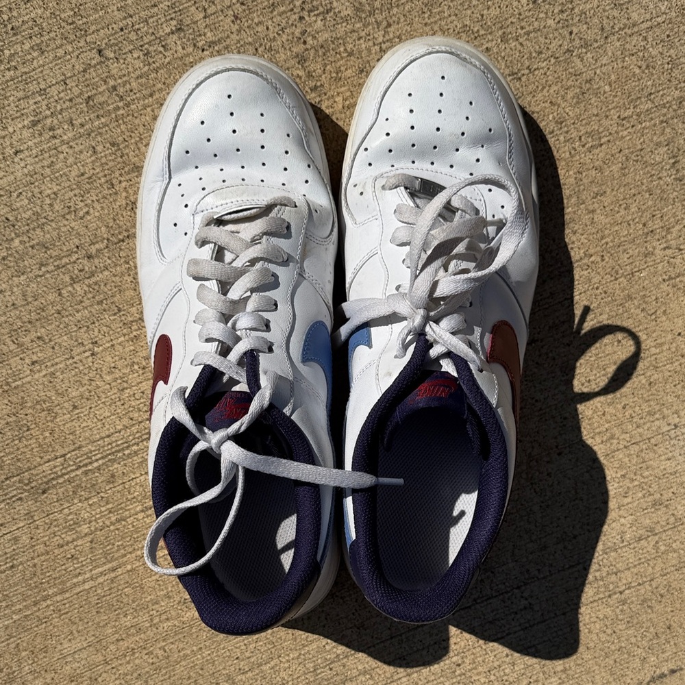 White Nike Sneakers with Red and Blue Accents